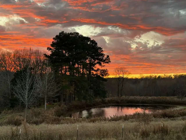 A fire-red sky over the smaller pond